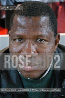  writer Ousmane Diarra  at the Salon du Livre (Book Fair) in Paris, March 2006..Copyright©Pascal Saez.Pascal Saez/Writer Pictures/Rosebud2