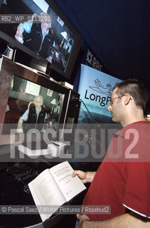 A visitor to the Edinburgh International Book Festival is using canadian writer Margaret Atwoods invention the Long Pen, to have his book signed by its author Norman Mailer. The Long Pen allows writers to remotely sign copies of their books.  Edinburgh International Book Festival 2007. ..Copyright©Pascal Saez/Writer Pictures/Rosebud2