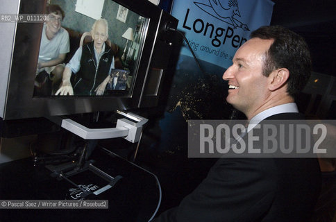 Scottish writer Andrew OHagan is talking to american author Norman Mailer through the video link of canadian writer Margaret Atwoods invention the Long Pen. The Long Pen allows writers to remotely sign copies of their books.  Edinburgh International Book Festival 2007. ..Copyright©Pascal Saez/Writer Pictures/Rosebud2