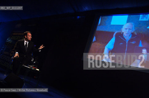 Scottish writer Andrew OHagan is talking to american author Norman Mailer through the video link of canadian writer Margaret Atwoods invention the Long Pen. The Long Pen allows writers to remotely sign copies of their books.  Edinburgh International Book Festival 2007. ..Copyright©Pascal Saez/Writer Pictures/Rosebud2