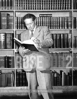 This photograph shows Lion Feuchtwanger engaged in one of his greatest passions-buying books. In this case, Feuchtwanger is at Dawsons Bookstore in 1949, formerly in downtown Los Angeles. In the days before freeways, Feuchwanger and his secretary, Hilde Waldo, would make all day treks to browse Dawsons bookstore...Copyright©USC Special Collections//Writer Pictures/Rosebud2