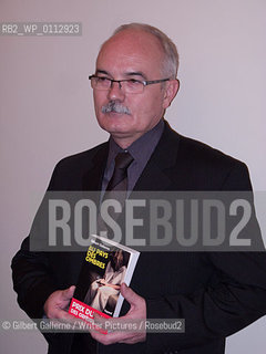 Gilbert Gallerne, with his book Au pays des ombres (In the shadows country) just after being awarded the Prix du quai des orfËvres 2010 in Paris, at the headoffice of the french police...copyright©Gilbert Gallerne/Writer Pictures/Rosebud2