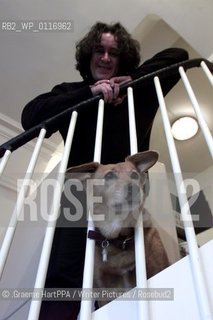 Richard Horne, aka Harry Horse, British author, illustrator and political cartoonist, with his dog Roo at his home near Loch Awe, Argyll and Bute, Scotland, November 22, 2000..©.Graeme HartPPA/Writer Pictures/Rosebud2
