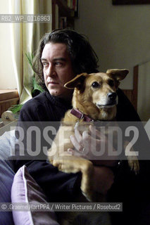 Richard Horne, aka Harry Horse, British author, illustrator and political cartoonist, with his dog Roo at his home near Loch Awe, Argyll and Bute, Scotland, November 22, 2000..©.Graeme HartPPA/Writer Pictures/Rosebud2