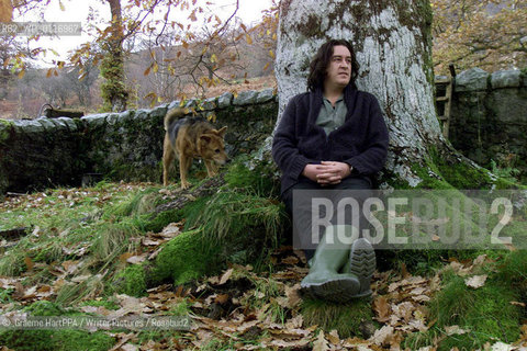 Richard Horne, aka Harry Horse, British author, illustrator and political cartoonist, with his dog Roo at his home near Loch Awe, Argyll and Bute, Scotland, November 22, 2000..©.Graeme HartPPA/Writer Pictures/Rosebud2