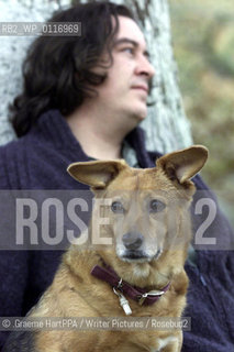 Richard Horne, aka Harry Horse, British author, illustrator and political cartoonist, with his dog Roo at his home near Loch Awe, Argyll and Bute, Scotland, November 22, 2000..©.Graeme HartPPA/Writer Pictures/Rosebud2