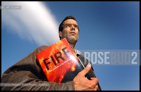 Sebastian Junger, American author, journalist, and documentary filmmaker, with his novel Fire, in Glasgow, Scotland, 18/09/2001...copyright©Victoria Stewart/Writer Pictures/Rosebud2