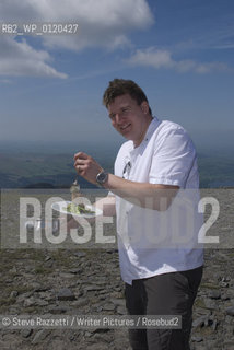 Chef Peter Sidwell serving dinner atop Skiddaw at the opening of the Keswick Mountain Festival in 2008..copyright©Steve Razzetti/Writer Pictures/Rosebud2