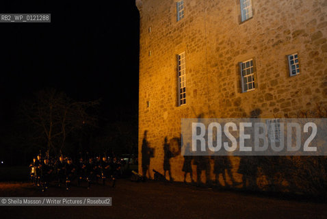 The Haddington Pipe Band cast shadows on the wall of Lennoxlove House as they mark the opening of the 2nd annual Lennoxlove Book Festival in Haddington, Scotland, November 19, 2010...Copyright©Sheila Masson/Writer Pictures/Rosebud2