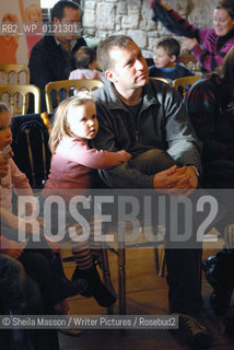 A young reader and her father await the start of the Pollys Pank Pyjamas event by writer Vivian French in the Great Hall during the 2nd annual Lennoxlove Book Festival at Lennoxlove House, Haddington, Scotland, November 20, 2010. ..Copyright©Sheila Masson/Writer Pictures/Rosebud2