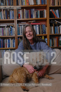 Author Sara Maitland, her isolated cottage in moorland in Galloway in the background. Seen in front of her bookshelf. With her pet dog Zoe..29th Oct 2008....Copyright©Robert Perry/TSPL/Writer Pictures/Rosebud2