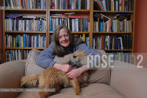 Author Sara Maitland, her isolated cottage in moorland in Galloway in the background. Seen in front of her bookshelf. With her pet dog Zoe..29th Oct 2008....Copyright©Robert Perry/TSPL/Writer Pictures/Rosebud2