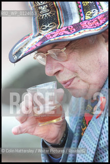 George Melly appears to sample a little of the Glasgow Jazz Festival sponsors brew, but all is not what it seems - because of Glasgow by-laws no alcohol can be taken on the street, so, as this was George Square, cold tea was the substitute. However Mr Melly declined to taste the tea, prefering to await a proper sample indoors ....  ..copyright©Colin Hattersley/Writer Pictures/Rosebud2
