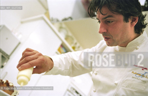Jean-Christophe Novelli of Michelin starred Auberge du Lac and Novelli puts the finishing touches to a dessert at a celebrity cook-athon for BBC Children in Need, Friday November 19 2004..©.Rogan MacDonald/Writer Pictures/Rosebud2