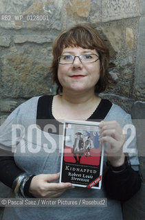 Scottish writer Louise Welsh, holding a copy of a new edition Of Robert Louis Stevensons Kidnapped, for which she wrote a preface..Here at the launch of the One Book-One Edinburgh campaign which will run throughout February 2007, and is designed to promote the reading of books in Edinburgh by getting the whole City reading the same book. The campaign is run by the Edinburgh UNESCO City of Litterature Trust, which commissioned the Kidnapped graphic novel, and the printing of thousands of copies of a new edition of R.L.Stevensons novel which will be distributed for free throughout the City..The launch was held at Edinburgh Castle and is part of a month-long series of events designed to boost awareness of reading, support literacy projects and engage with communities...Copyright©Pascal Saez/Writer Pictures/Rosebud2