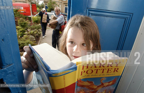 Mine, all mine!: Natalie Binnie (aged 10, from Morningside, Edinburgh) clutches her freshly delivered copy of Harry Potter and the Order of the Phoenix. Pictured with her are postmen Darren Gilchrist (nearest) and Gavin Milne.. (Permission from parent)...copyright©Colin Hattersley/Writer Pictures/Rosebud2