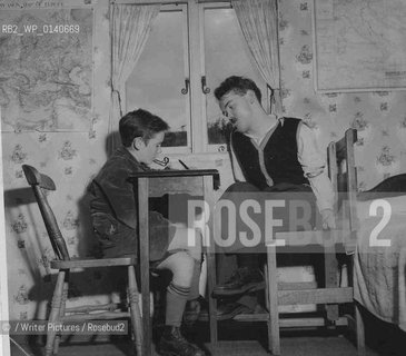 Christy Brown disabled Irish writer. Francis Brown transcibing for his brother in 1954 Christy is sitting in what the family nicknamed the electric chair with restraints to control his muscle spasms and improve posture..Copyright©/Writer Pictures/Rosebud2