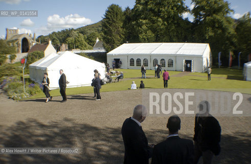 Borders Book Festival in Melrose..Guests enjoy the sunshine outside the Festival Marquee with Melrose Abbey visible in the background..Copyright©Alex Hewitt/Writer Pictures/Rosebud2