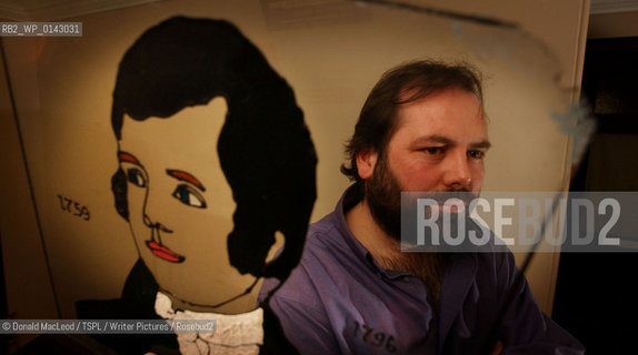 Gerard Carruthers, with an image of Robert Burns, at Glasgow University..copyright©Donald MacLeod/TSPL/Writer Pictures/Rosebud2