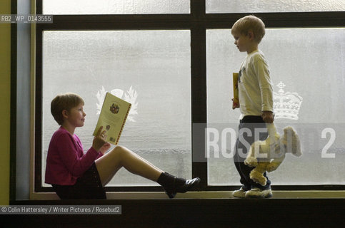 National Library of Scotland, Childrens Exhibition This Book Belongs To Me, 30/05/02:.This is my book!: Ellen Mason (aged nine) enjoys a good read with her brother Alex (aged four) at the opening of the This Book Belongs To Me exhibition of childrens literature at the National Library of Scotland...copyright©Colin Hattersley/Writer Pictures/Rosebud2