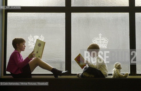 National Library of Scotland, Childrens Exhibition This Book Belongs To Me, 30/05/02:.This is my book!: Ellen Mason (aged nine) enjoys a good read with her brother Alex (aged four) at the opening of the This Book Belongs To Me exhibition of childrens literature at the National Library of Scotland...copyright©Colin Hattersley/Writer Pictures/Rosebud2