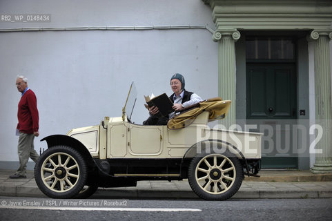 Wigtown Book Festival. Paul Kingston takes a break from touring in his 1909 Renault with a book from The Book Shop...copyright©Jayne Emsley/TSPL/Writer Pictures/Rosebud2