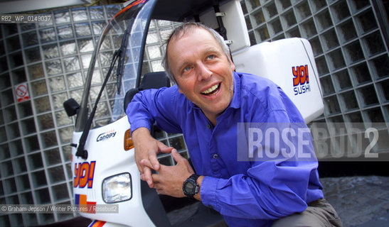Simon Woodroffe, Chairman of Yo! Sushi who are famous for their automated restaurants.   Pictured with one of their delivery bikes..copyright©Graham Jepson/Writer Pictures/Rosebud2