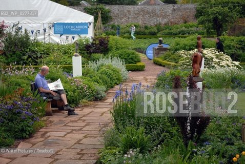 A visitor reading in the sunshine during the Borders Book Festival in M©Writer Pictures/Rosebud2
