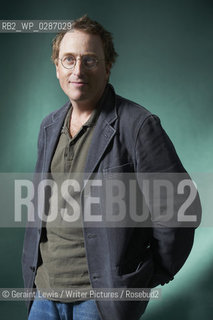 Jon Ronson, novelist and writer at The Edinburgh International Book Festival 2011. After the big screen version of his The Men Who Stare at Goats, Ronson could be forgiven for settling back and writing about annoying waiters and irritating parents. But entertaining as his writing about ordinary life is, he really gets motoring when delving into oddball affairs on a more global scale. In The Psychopath Test, he wants to know whether you can easily tell if someone is a bit unhinged and if it is really true that those in power have many of the characteristics of your classic psychopath..Copyright©Geraint Lewis/Writer Pictures/Rosebud2