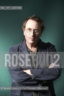 Jon Ronson, novelist and writer at The Edinburgh International Book Festival 2011. After the big screen version of his The Men Who Stare at Goats, Ronson could be forgiven for settling back and writing about annoying waiters and irritating parents. But entertaining as his writing about ordinary life is, he really gets motoring when delving into oddball affairs on a more global scale. In The Psychopath Test, he wants to know whether you can easily tell if someone is a bit unhinged and if it is really true that those in power have many of the characteristics of your classic psychopath..Copyright©Geraint Lewis/Writer Pictures/Rosebud2