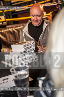 Irvine Welsh at Bookslam literary night at York Hall,  Bethnal Green, London. The night had a boxing theme as authors took the ring to deliver their readings in this iconic boxing venue in the heart of East London..©12th August 2014 ..Photograph by Nick Cunard/Writer Pictures/Rosebud2