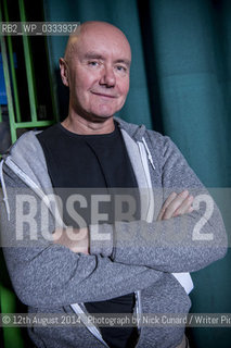 Irvine Welsh at Bookslam literary night at York Hall,  Bethnal Green, London. The night had a boxing theme as authors took the ring to deliver their readings in this iconic boxing venue in the heart of East London..©12th August 2014 ..Photograph by Nick Cunard/Writer Pictures/Rosebud2