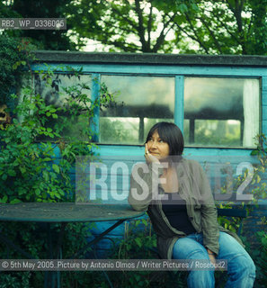 Ali Smith in her garden in Cambridge. .Smith is the author of The Accidental which was shortlisted for the Booker in 2005. She has published 2 other novels, Like and Hotel World..©5th May 2005..Picture by Antonio Olmos/Writer Pictures/Rosebud2