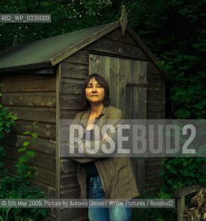 Ali Smith in her garden in Cambridge. .Smith is the author of The Accidental which was shortlisted for the Booker in 2005. She has published 2 other novels, Like and Hotel World..©5th May 2005..Picture by Antonio Olmos/Writer Pictures/Rosebud2