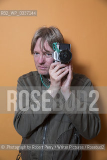 Michel Faber, author in his Edinburgh flat. 29th September 2014..©.Photograph by Robert Perry/Writer Pictures/Rosebud2