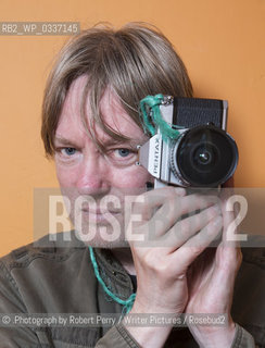 Michel Faber, author in his Edinburgh flat. 29th September 2014..©.Photograph by Robert Perry/Writer Pictures/Rosebud2