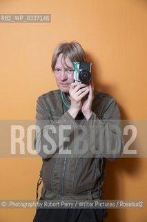 Michel Faber, author in his Edinburgh flat. 29th September 2014..©.Photograph by Robert Perry/Writer Pictures/Rosebud2