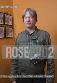 Michel Faber, author in his Edinburgh flat. 29th September 2014..©.Photograph by Robert Perry/Writer Pictures/Rosebud2