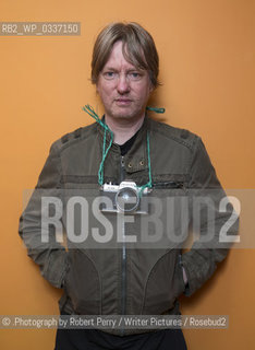 Michel Faber, author in his Edinburgh flat. 29th September 2014..©.Photograph by Robert Perry/Writer Pictures/Rosebud2