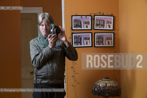 Michel Faber, author in his Edinburgh flat. 29th September 2014..©.Photograph by Robert Perry/Writer Pictures/Rosebud2