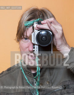 Michel Faber, author in his Edinburgh flat. 29th September 2014..©.Photograph by Robert Perry/Writer Pictures/Rosebud2