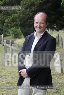 Ian Mortimer, the Moretonhampsted based author of The Time Travellers Guide to Elizabethan England. The bestselling author signed books at the first Chagword Literary Festival event at Chagford Devon. Chagword Literary Festival opens in March 2013. Pictured here in the churchyard of St Michaels church Chagford. ..©Picture by Stuart Clarke/Writer Pictures/Rosebud2