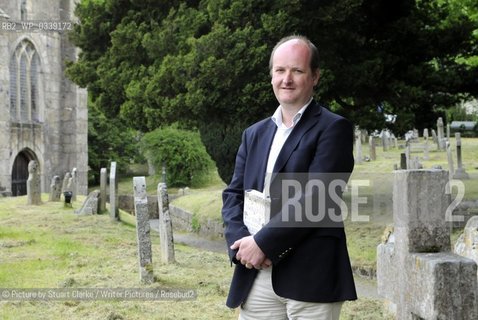 Ian Mortimer, the Moretonhampsted based author of The Time Travellers Guide to Elizabethan England. The bestselling author signed books at the first Chagword Literary Festival event at Chagford Devon. Chagword Literary Festival opens in March 2013. Pictured here in the churchyard of St Michaels church Chagford. ..©Picture by Stuart Clarke/Writer Pictures/Rosebud2