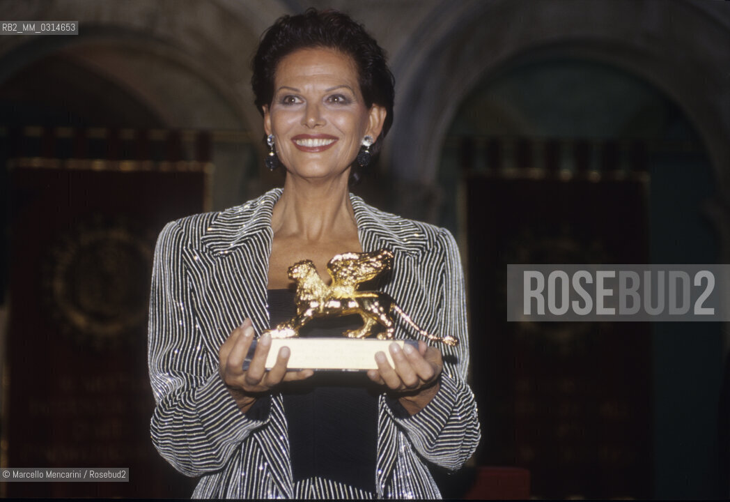 Venice Film Festival 1993, Actress Claudia Cardinale holding the Golden Lion Award for career achievement / Mostra del Cinema di Venezia 1993. Lattrice Claudia Cardinale con il premio Leone doro alla carriera - ©Marcello Mencarini/Rosebud2