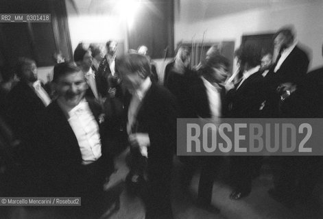 Rome, Conservatory of Santa Cecilia at via dei Greci (about 1980). The Orchestra before a concert / Roma, Conservatorio Santa Cecilia (1980 circa). Orchestra prima di un concerto  - ©Marcello Mencarini/Rosebud2
