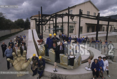 LAquila, 1994. Owners and workers in front of the amusement park factory A.D.A. (Advancement Development Attraction), former weapon factory / Proprietari e operai davanti alla fabbrica di parchi giochi A.D.A. (Advancement Development Attraction), ex fabbrica di armi - ©Marcello Mencarini/Rosebud2