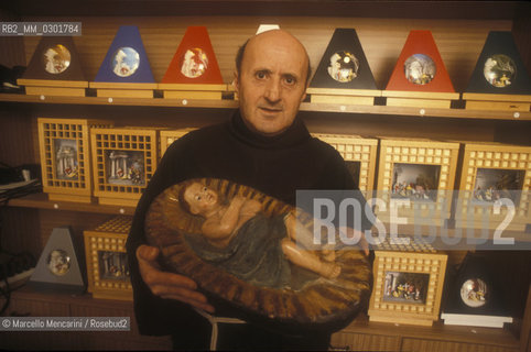 Bologna, 1983. Frati minori dellAntoniano (Franciscan Friars of Saint Anthony). Father Giangabriele Chierici holding a Baby Jesus crib statue / Bologna, 1983. Frati minori dellAntoniano. Padre Giangabriele Clerici con una statua da presepe di Gesù bambino - ©Marcello Mencarini/Rosebud2