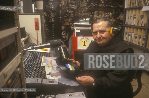 Bologna, 1983. Frati minori dellAntoniano (Franciscan Friars of Saint Anthony). Father Gabriele Adani at Radio Tau / Bologna, 1983. Frati minori dellAntoniano. Padre Gabriele Adani a Radio Tau - ©Marcello Mencarini/Rosebud2