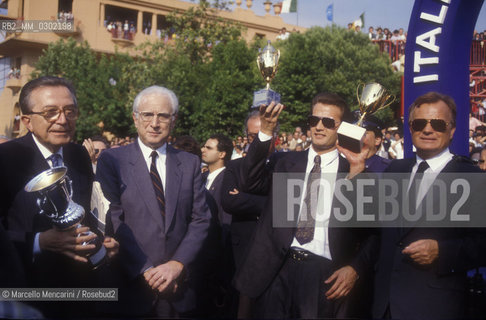 Rome, Capannelle Hippodrome, about 1988. Giulio Andreotti, Francesco Cossiga, Antonio Balzarini and his son Jo at Italian Derby / Roma, Ippodromo Le Capannelle, 1988 circa. Giulio Andreotti, Francesco Cossiga, Antonio Balzarini e suo figlio Jo al derby di galoppo - ©Marcello Mencarini/Rosebud2