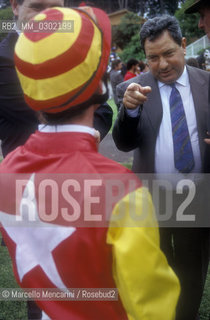 Rome, Capannelle Hippodrome, about 1988. Luciano Gaucci speaking with a jockey at Italian Derby /  Roma, ippodromo Le Capannelle, 1988 circa. Luciano Gaucci parla con un fantino durante il derby - ©Marcello Mencarini/Rosebud2